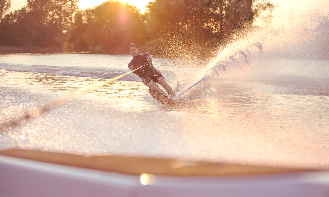 Trentham Waters Resort - Water skiing on lake at sunset